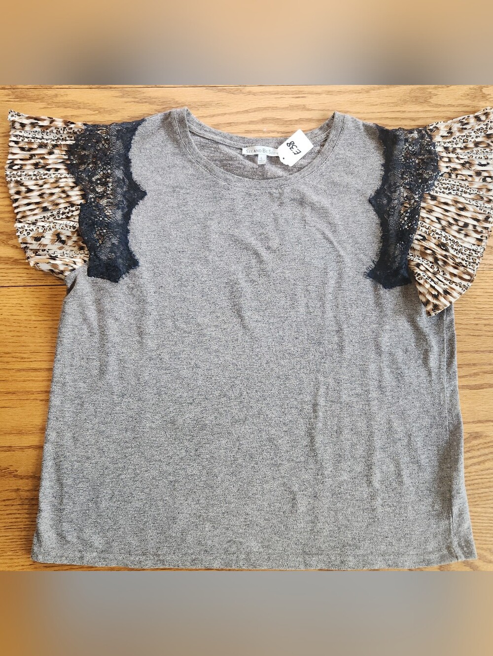 E38 See And Be Seen Gray women's top Lace-Trimmed & animal print ruffle sleeve